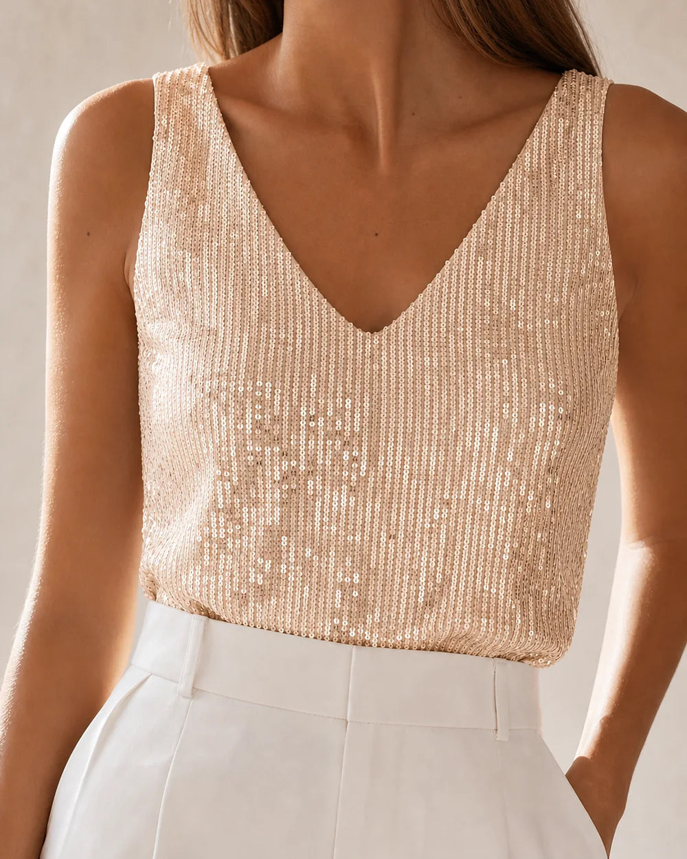 Women's apricot sequin V-neck tank top in a front three-quarter view — momount-martha-sequin-top-apricot-11-variant.webp