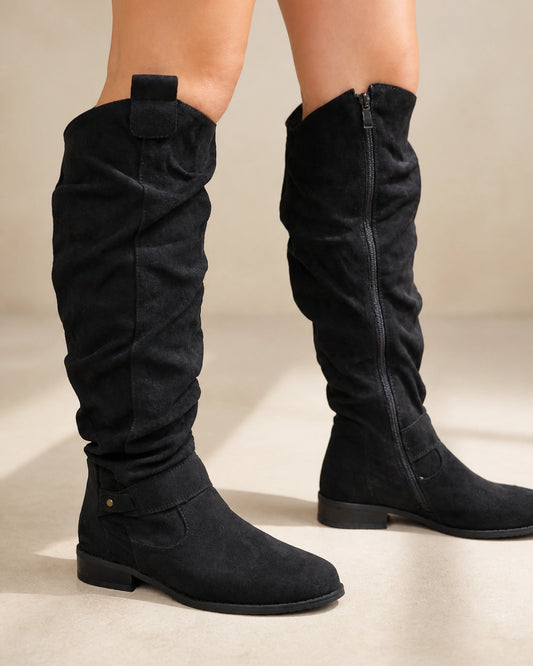 Exact black slouch knee-high boots, hero worn view.