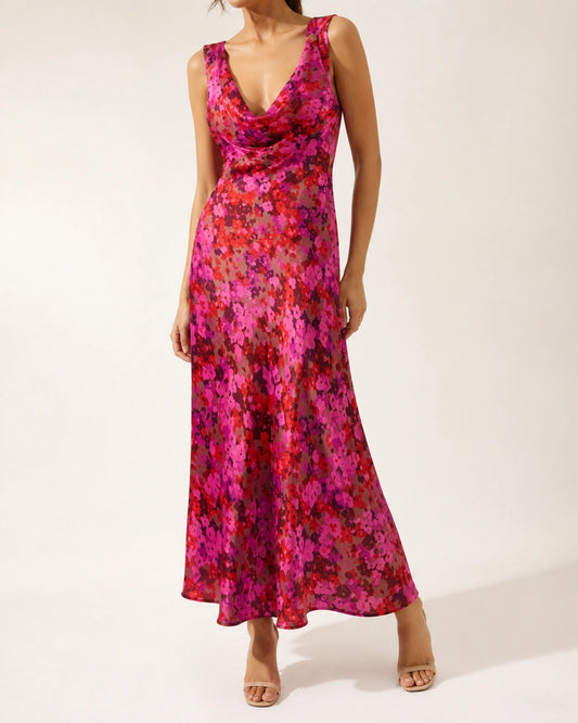 Women's pink floral sleeveless cowl-neck bias-cut maxi dress, worn product-first hero.