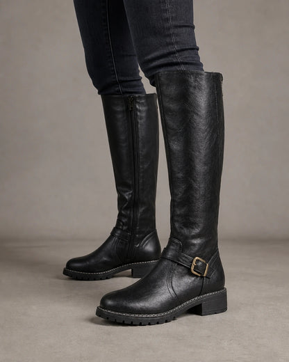 Women's black buckle-strap knee-high riding boots, lateral profile.