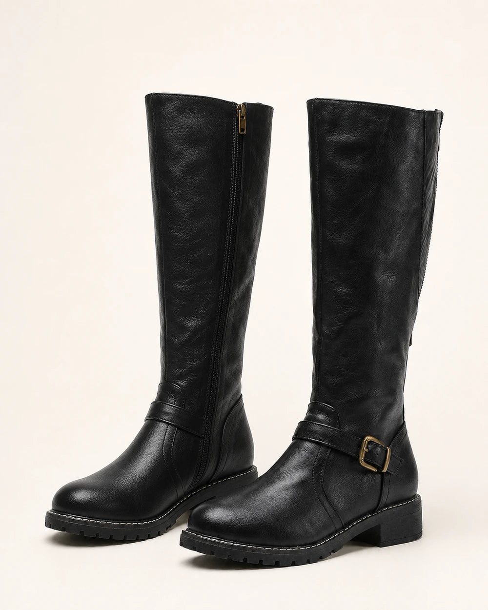 Women's black buckle-strap knee-high riding boots, product-only pair.