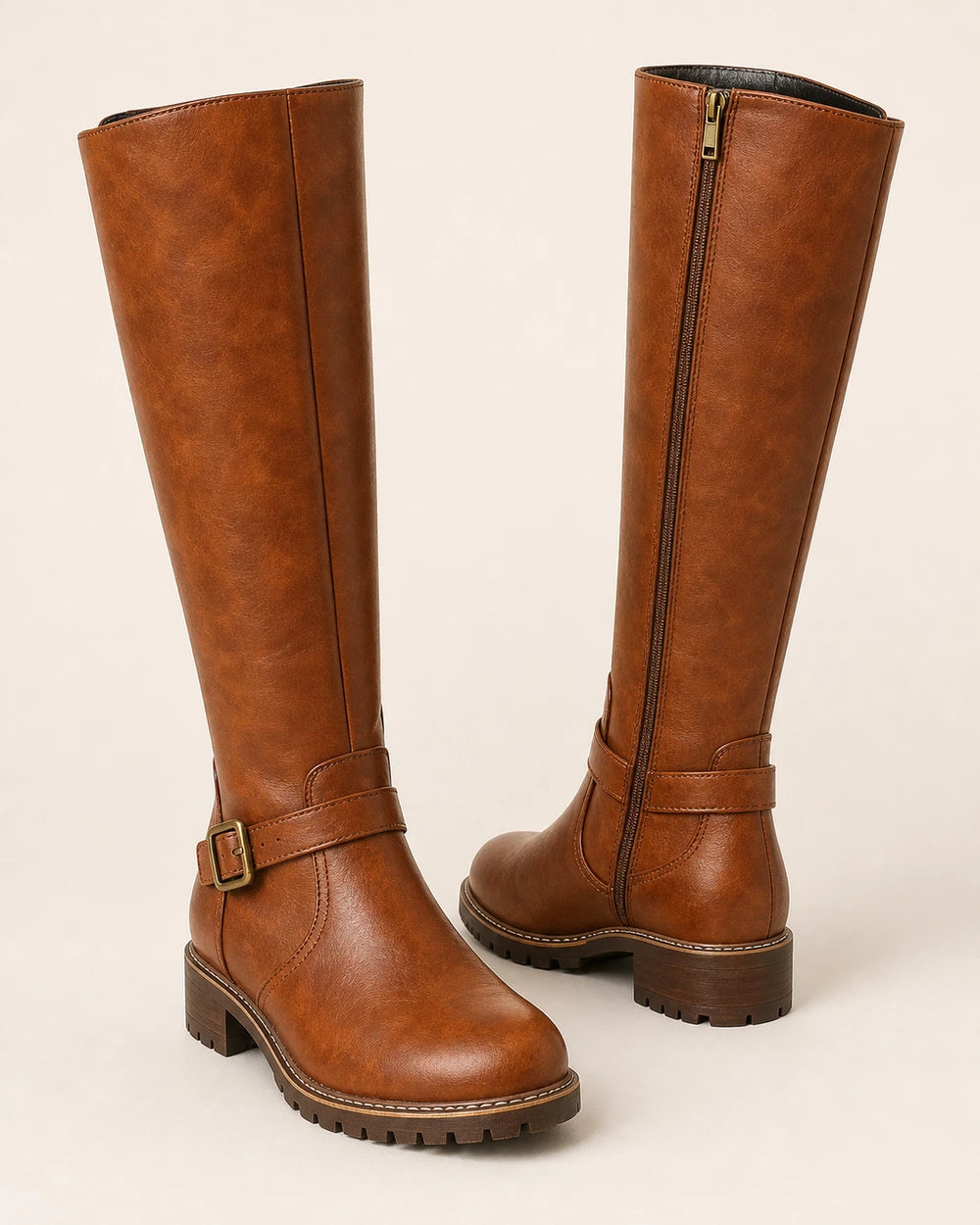 Women's brown buckle-strap knee-high riding boots, product-only pair.