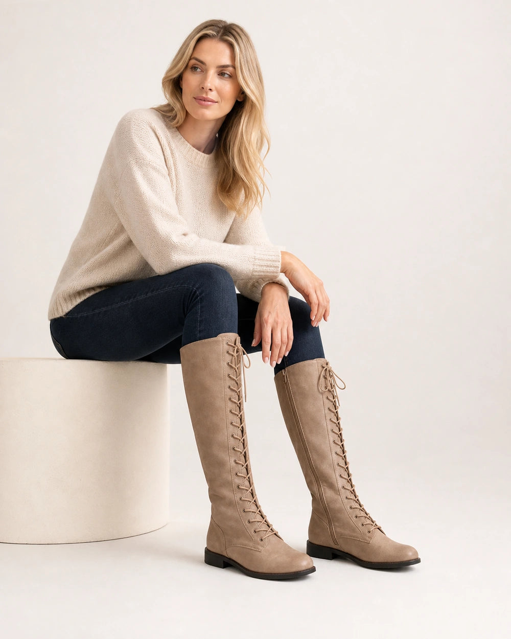 Women's beige lace-up knee-high boots, hero view.