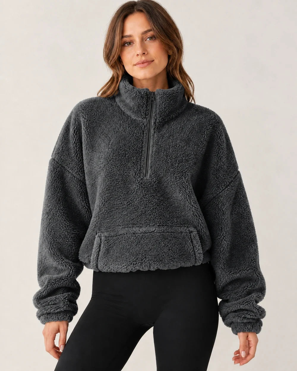 Women's grey plush half-zip pullover, worn front view
