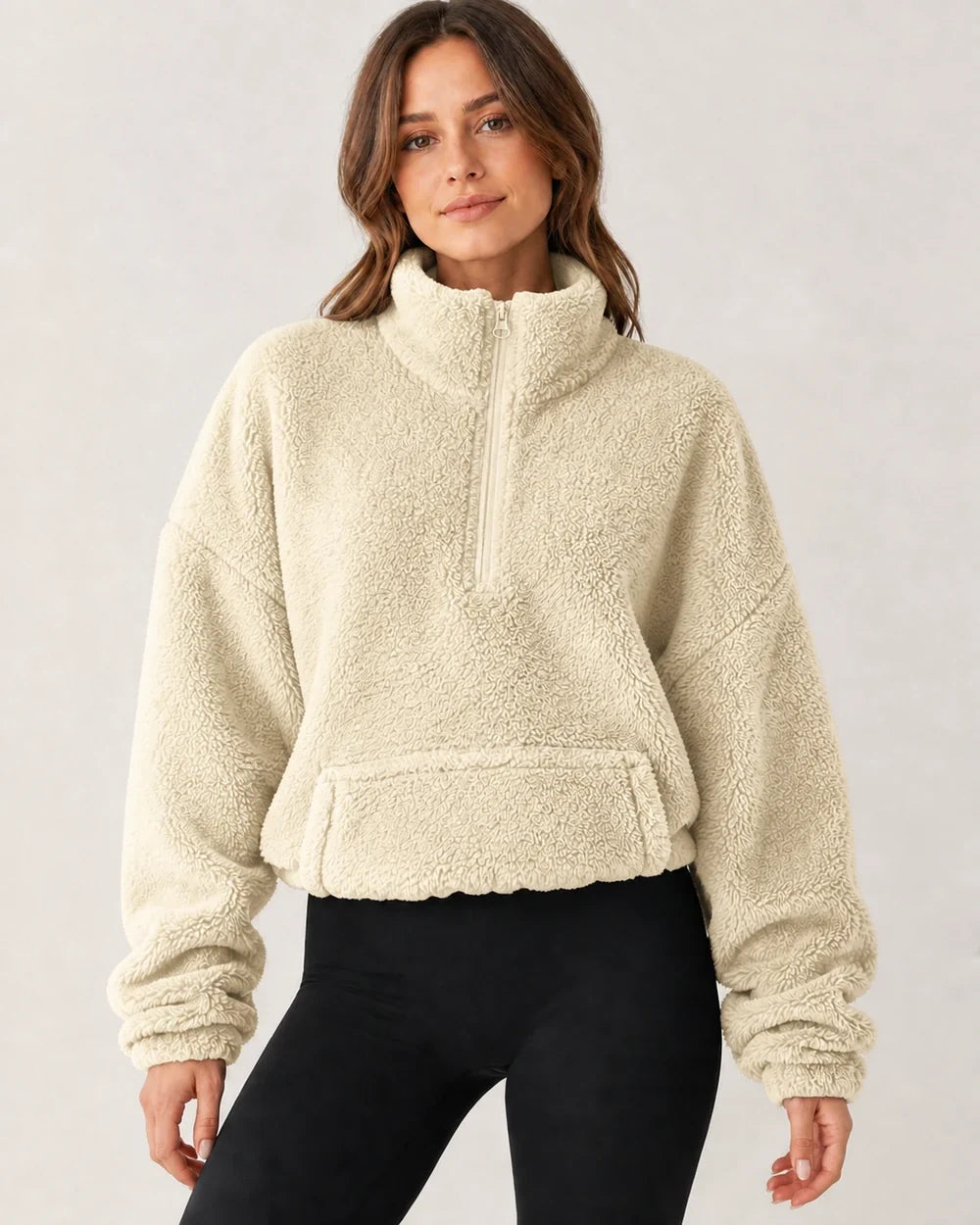 Women's beige plush half-zip pullover, worn front view
