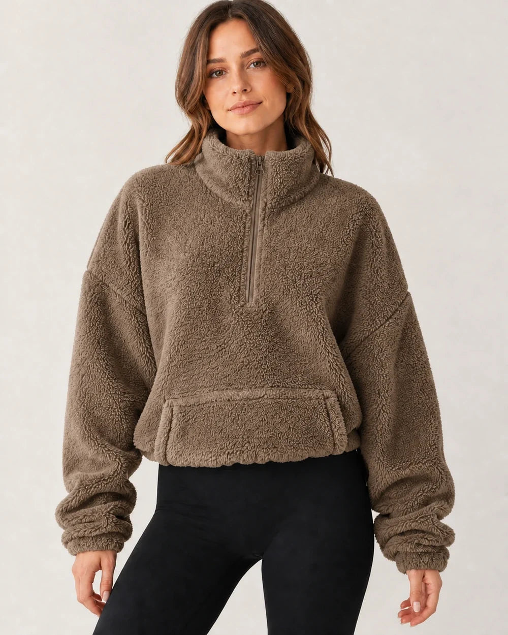 Women's brown plush half-zip pullover, worn front view