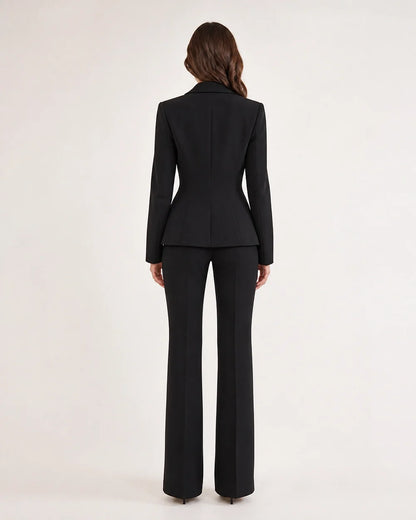 Black fitted blazer and trousers set for women, back view