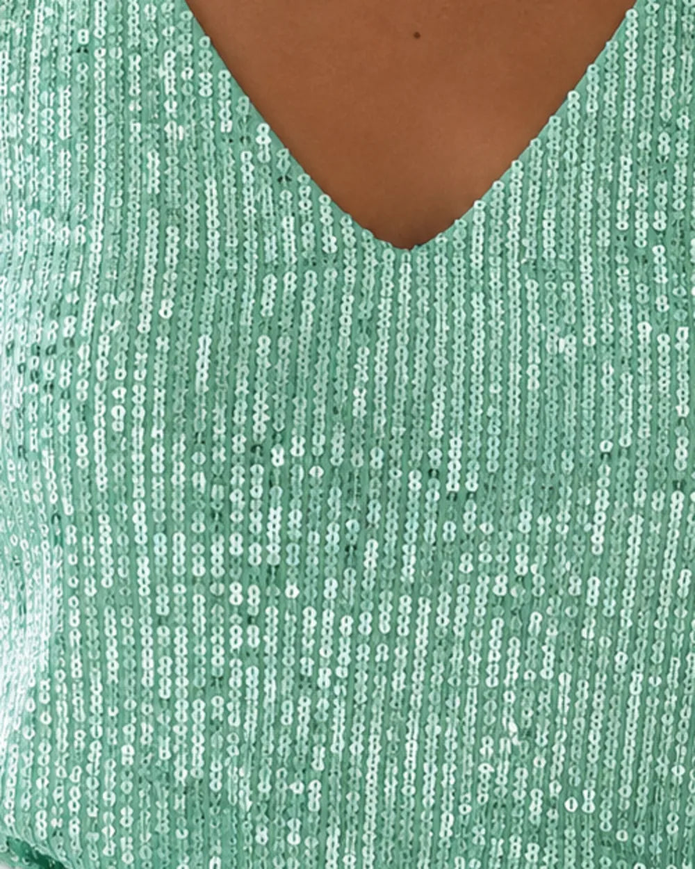 Close-up of the green top's V neckline and vertical sequin rows — momount-martha-sequin-top-green-05-sequin-detail.webp