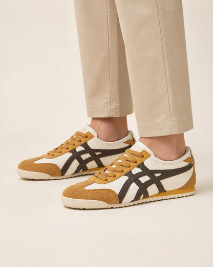 Men wearing brown-yellow retro panel sneakers, close product-first view.