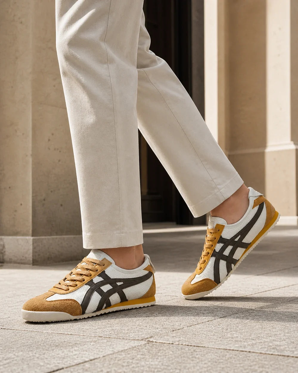 Men wearing brown-yellow retro panel sneakers in motion.