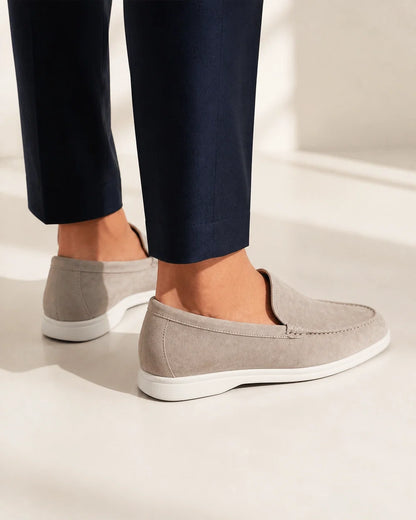Rear and heel view of beige suede-effect slip-on loafers.