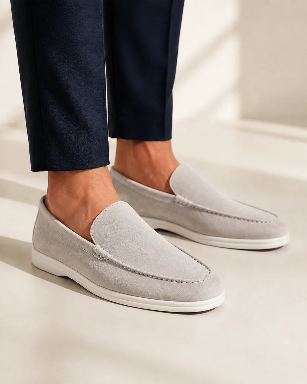 Men wearing grey suede-effect slip-on loafers, close product-first view.