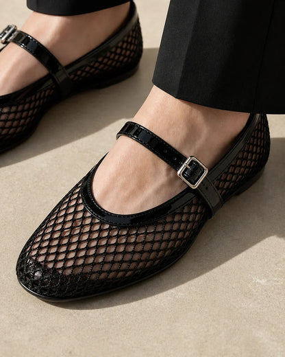 Women’s black mesh Mary Jane ballet flats, mesh strap and buckle construction detail.