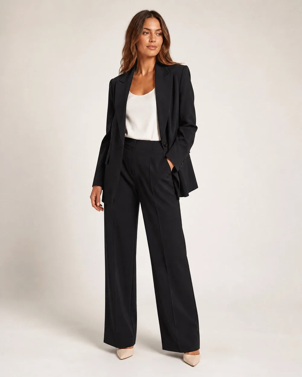 Black relaxed blazer and wide-leg trousers set for women, three-quarter view