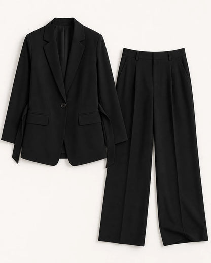 Black relaxed blazer and wide-leg trousers set for women, flat lay