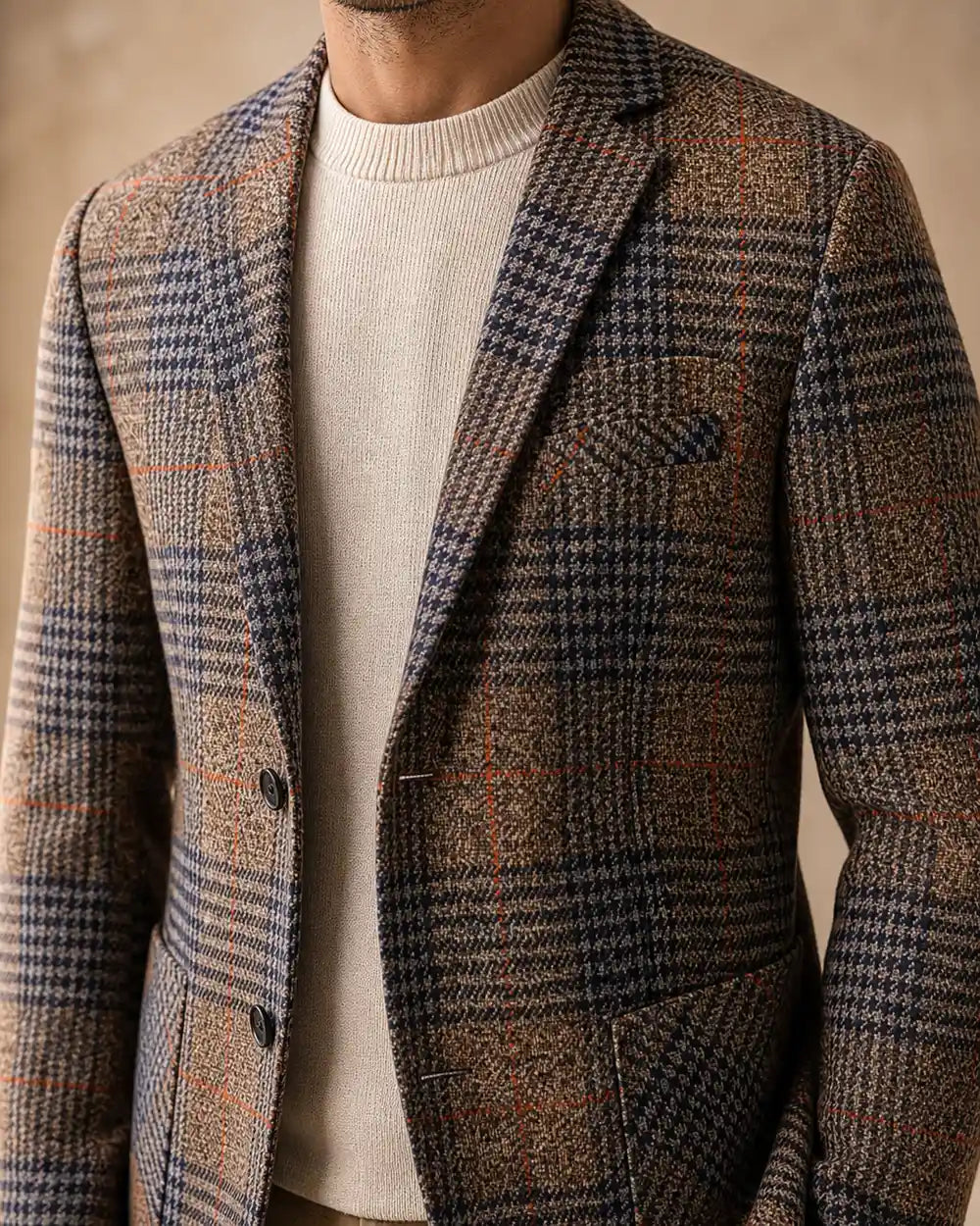 Brown plaid blazer for men, lapel and fabric detail.