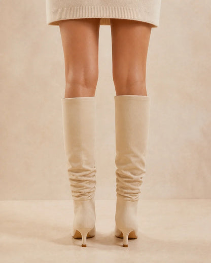 Beige slouchy knee-high boots, rear view