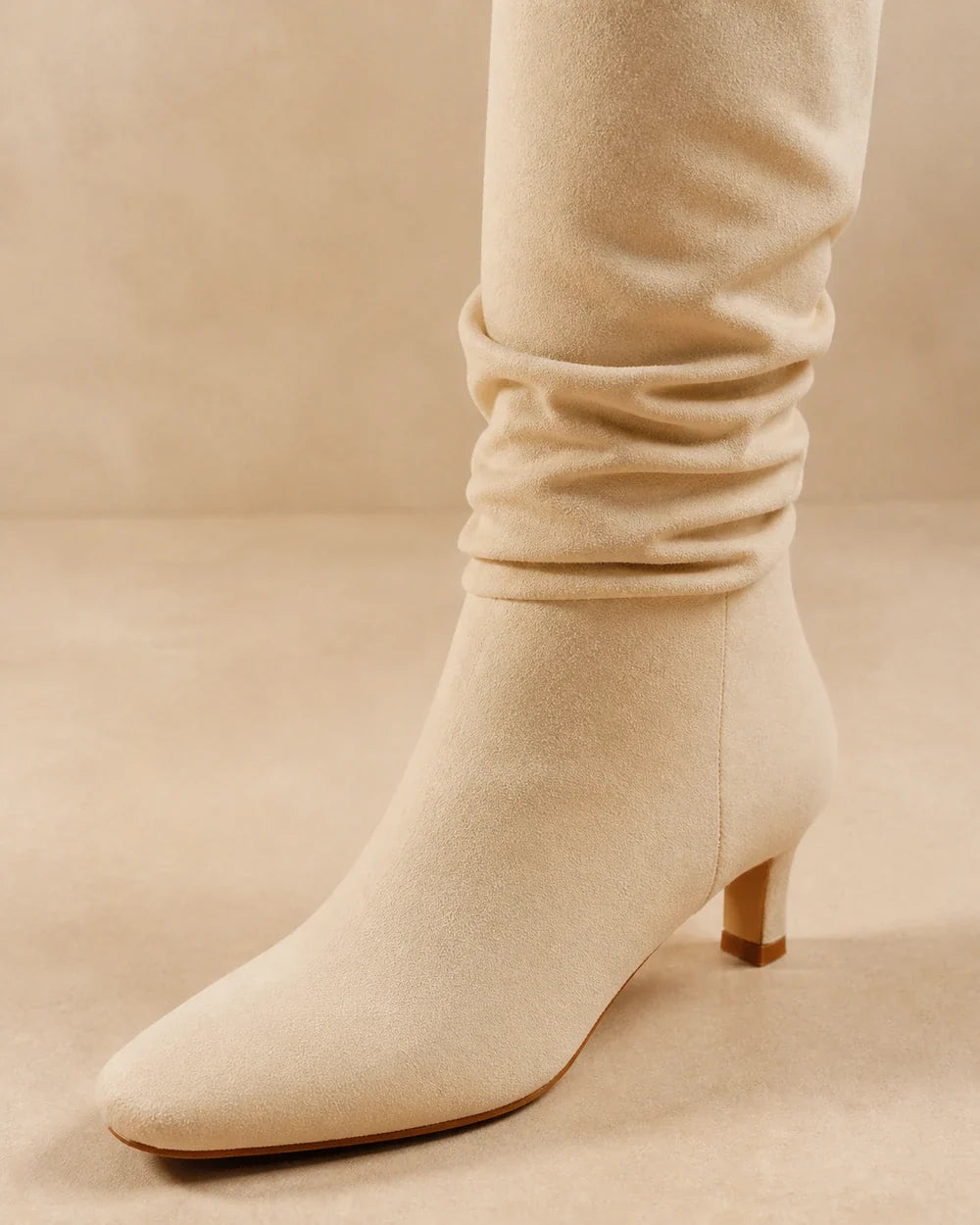 Beige slouchy knee-high boots, detail view