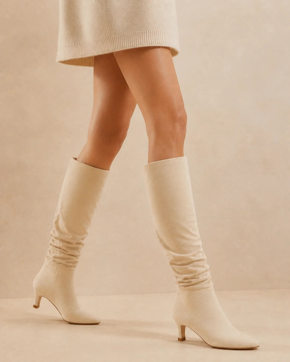 Beige slouchy knee-high boots, movement view
