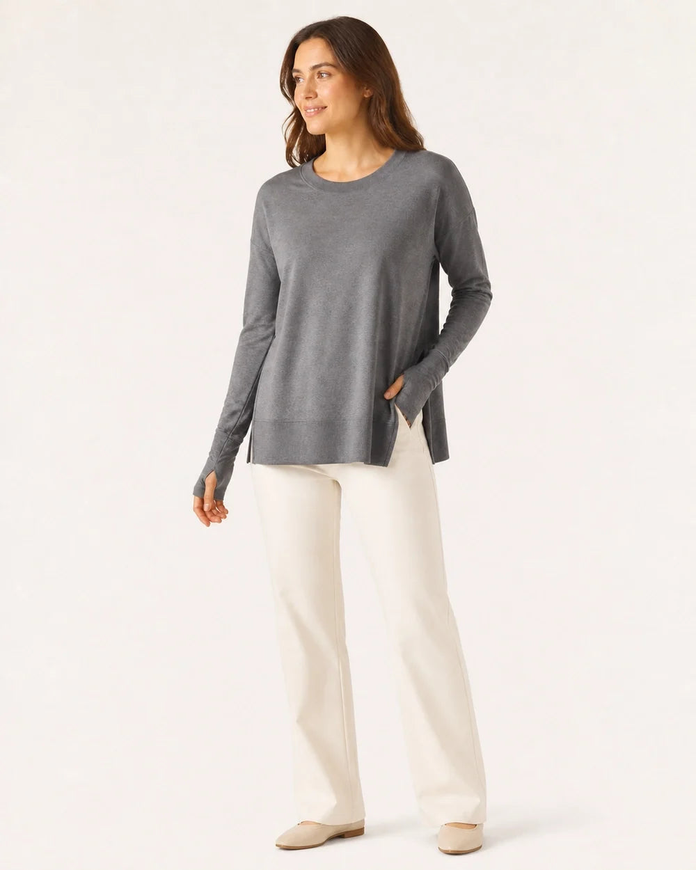 Women's charcoal dolman thumbhole pullover styled with ivory trousers
