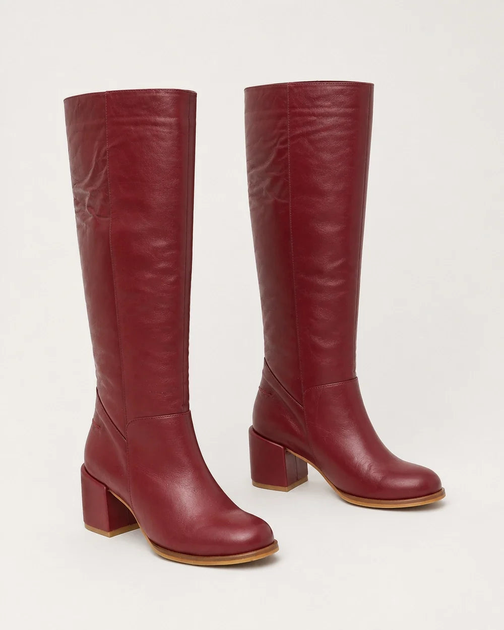 Burgundy leather knee-high boots, product-only view