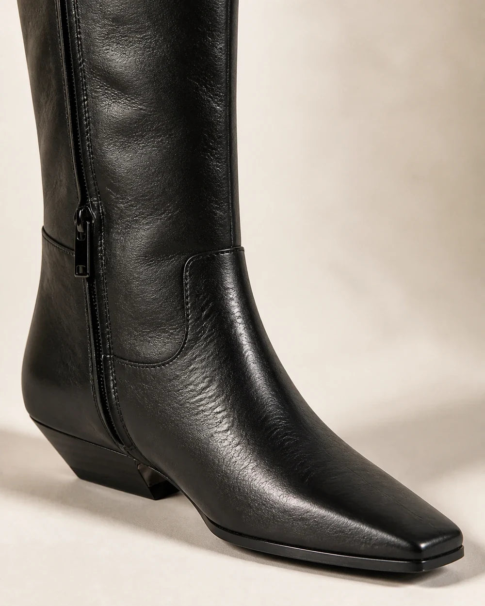 Cool-black square-toe knee-high boots, detail view