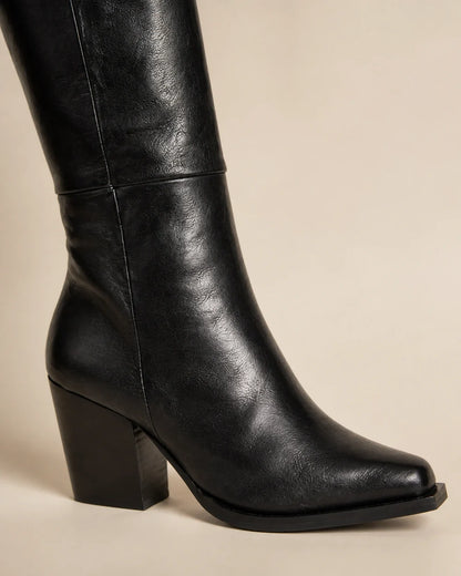 Black pointed-toe knee-high boots, detail view