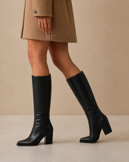 Black pointed-toe knee-high boots, movement view