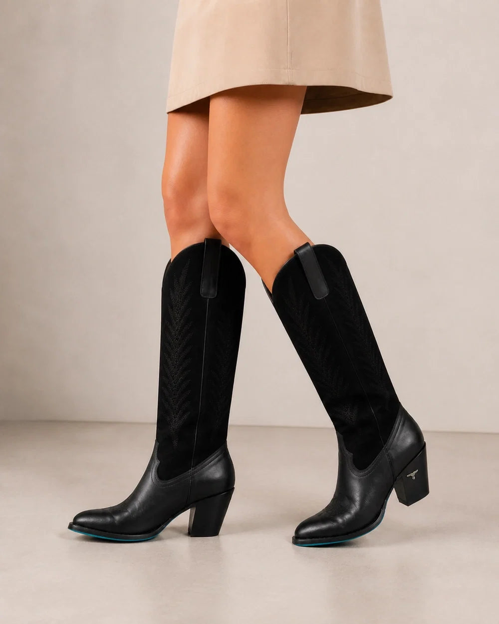 Jet-black leather and suede Western knee-high boots, movement view
