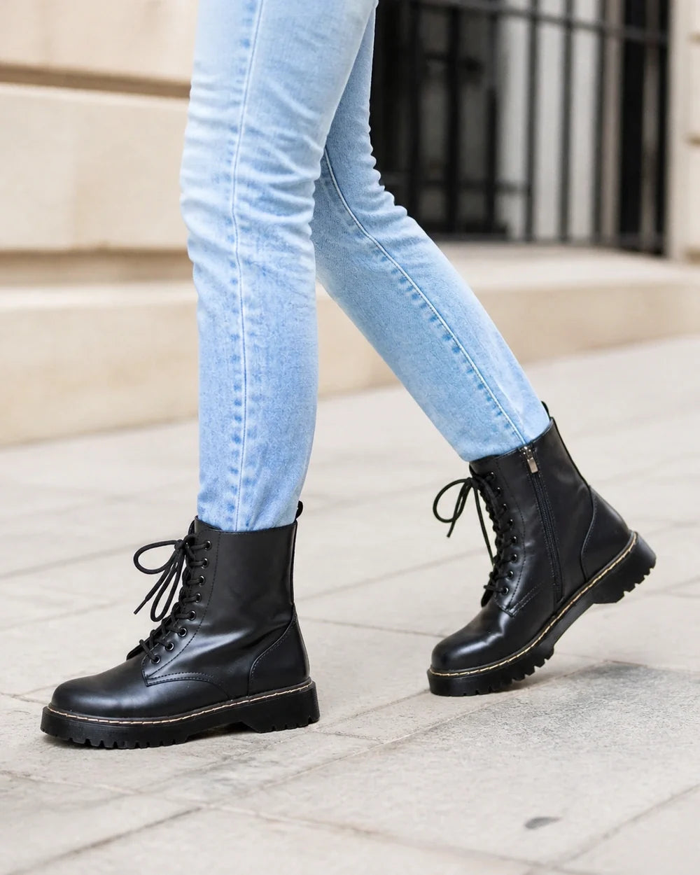 Black lace-up winter ankle boots for women, walking view