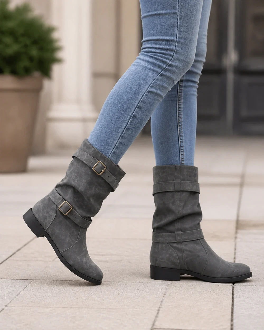 Grey low-heel buckle slouch boots for women, walking view