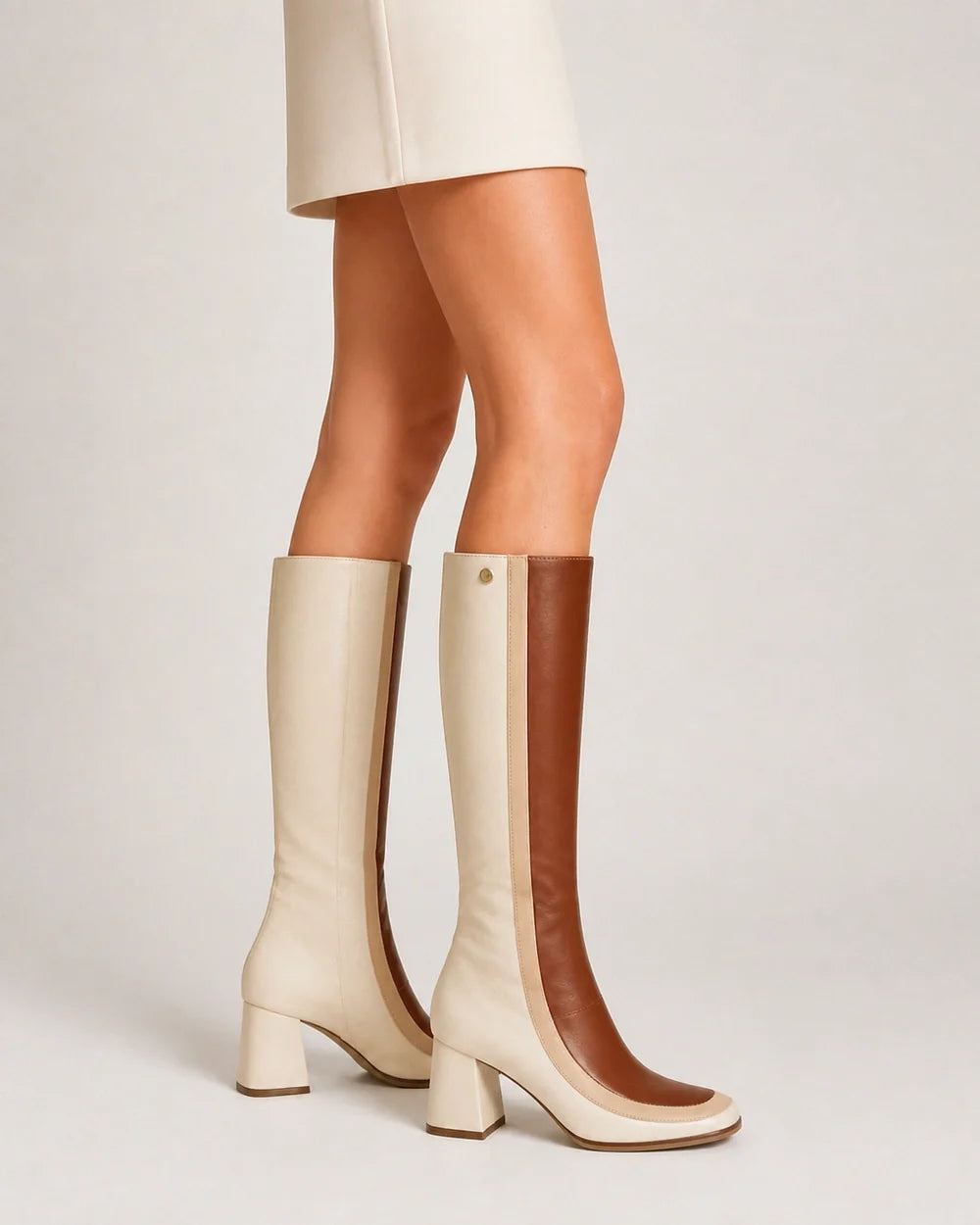 Ivory and tan colour-block knee-high boots, profile view