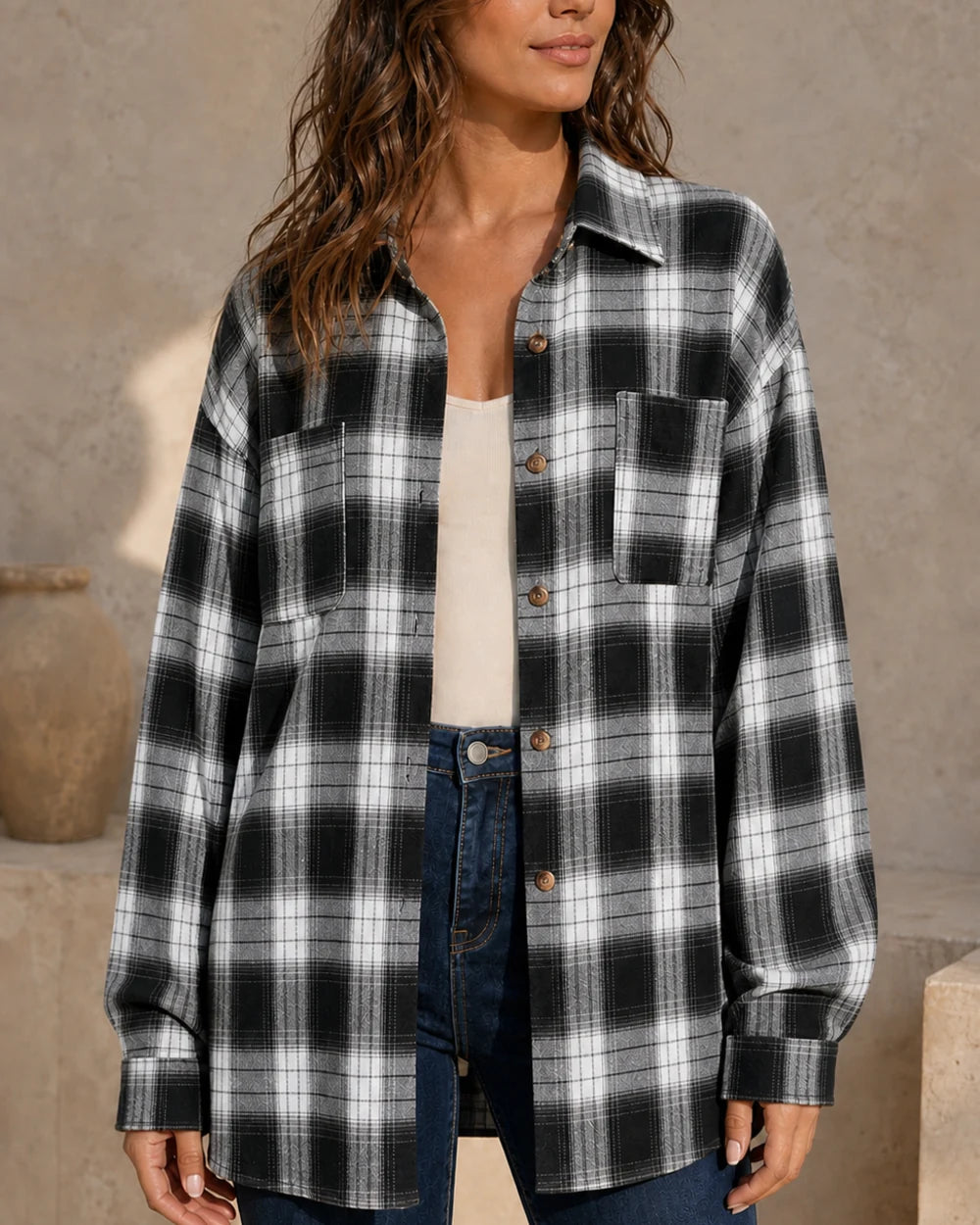 Women's black, white and grey oversized plaid shirt, front three-quarter worn view. — momount-womens-oversized-plaid-shirt-black-13-hero.webp