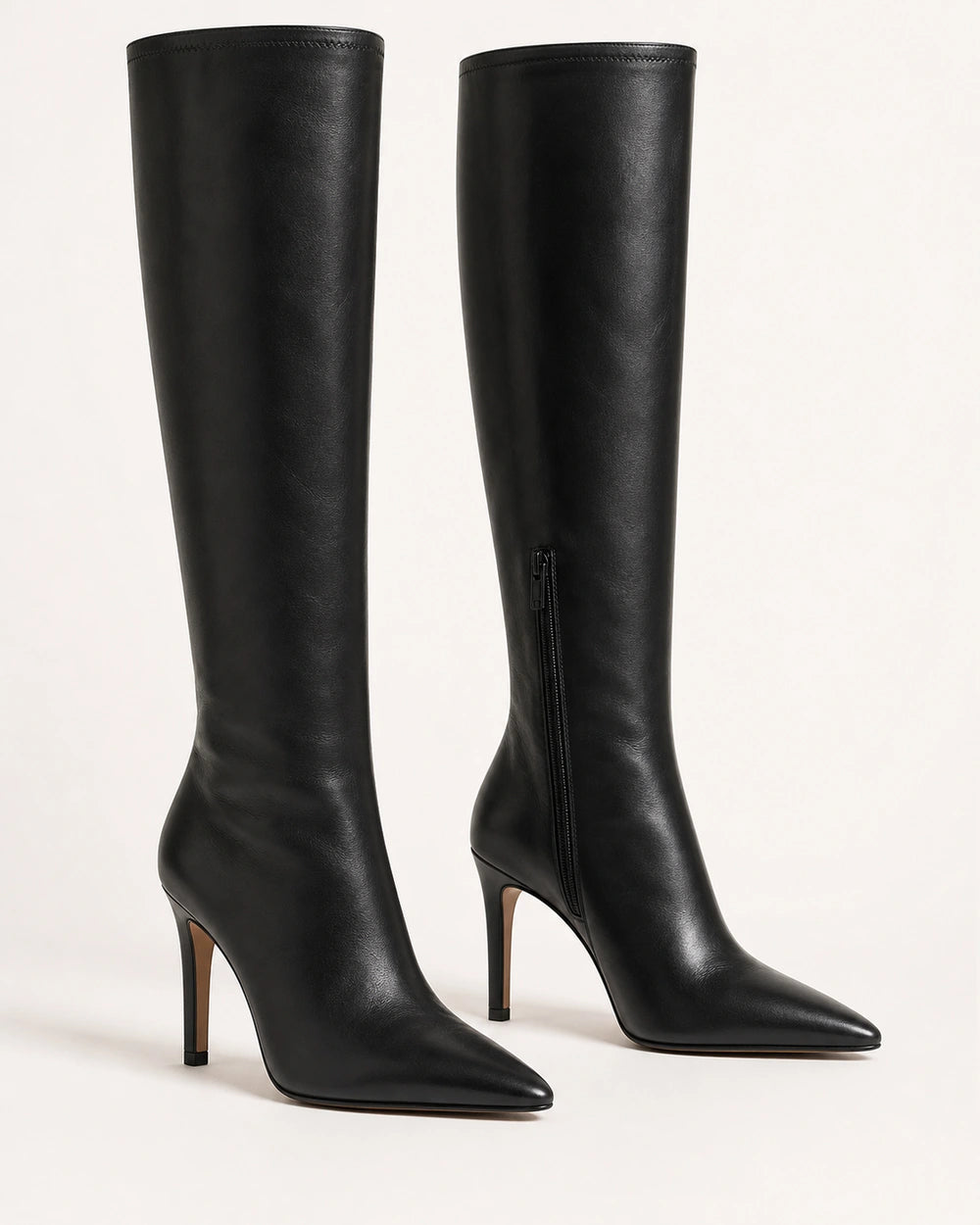 Women's black pointed-toe stiletto knee-high boots, product-only pair.