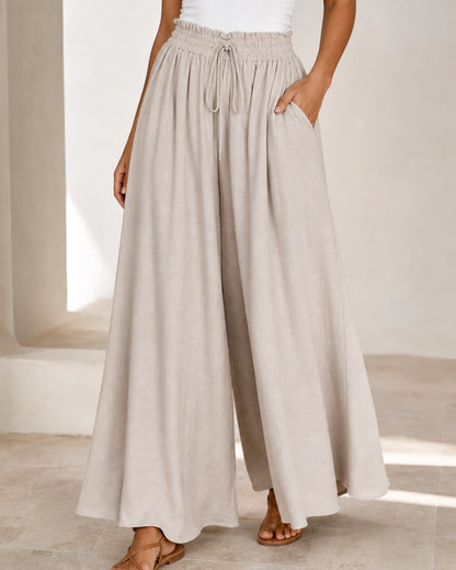 Women's high-waist wide-leg trousers in Apricot, quarter view. — womens-wide-leg-trousers-apricot-04-three-quarter.webp