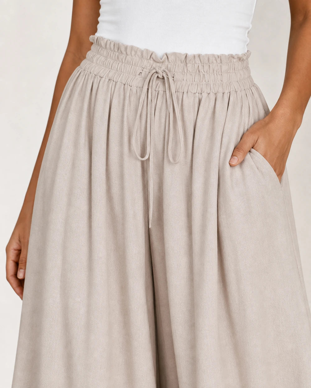 Women's high-waist wide-leg trousers in Apricot, detail view. — womens-wide-leg-trousers-apricot-05-waist-detail.webp