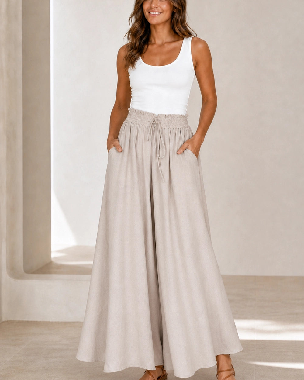 Women's high-waist wide-leg trousers in Apricot, styling view. — womens-wide-leg-trousers-apricot-07-styling.webp